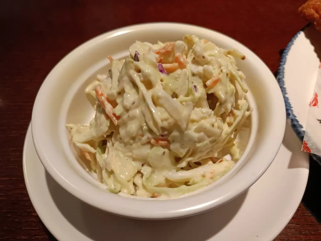 A bowl of creamed coleslaw