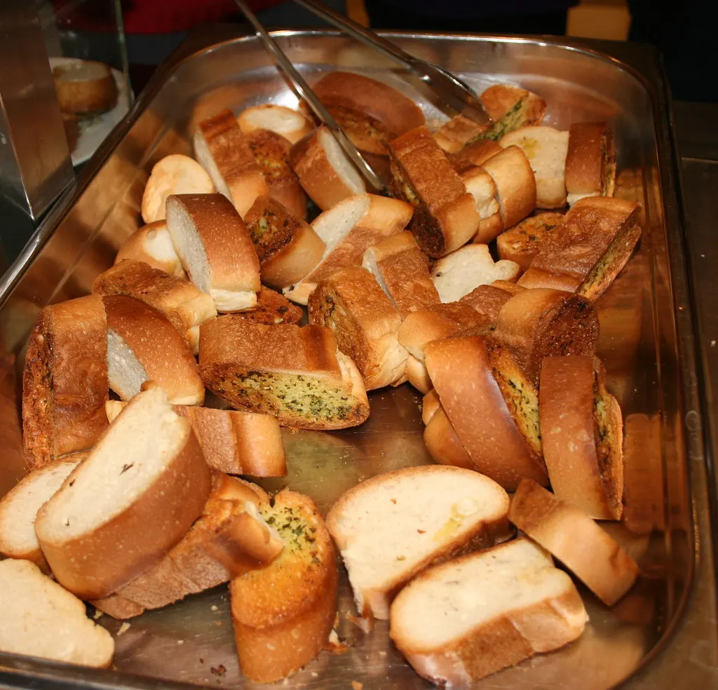 A tray of sliced garlic bread