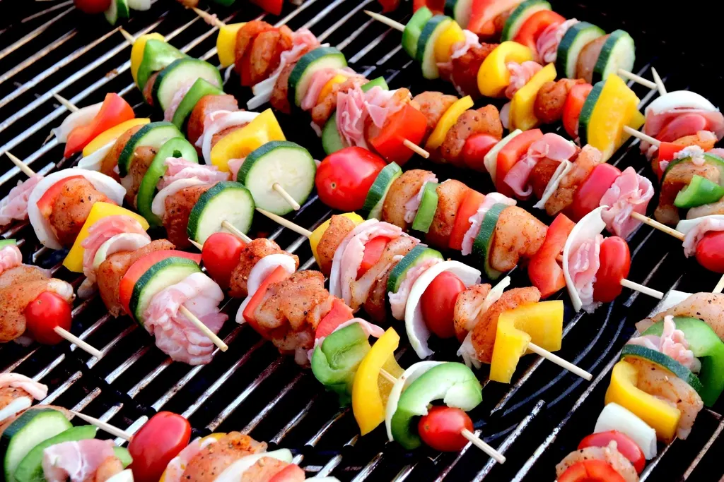Kebab skewers grilling over charcoal