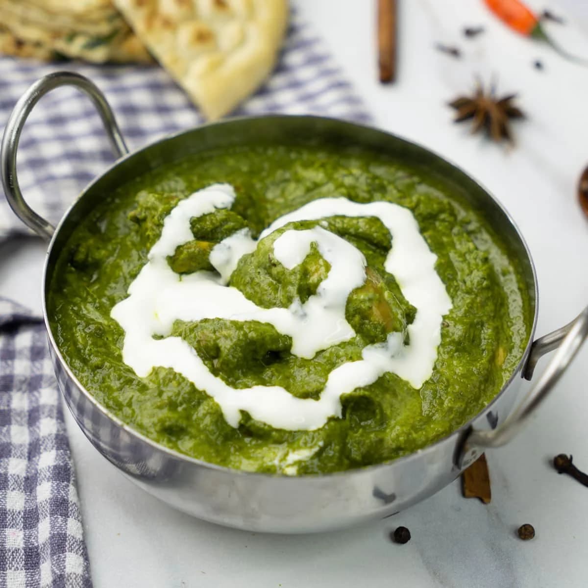 Paneer cooked with spinach and spices